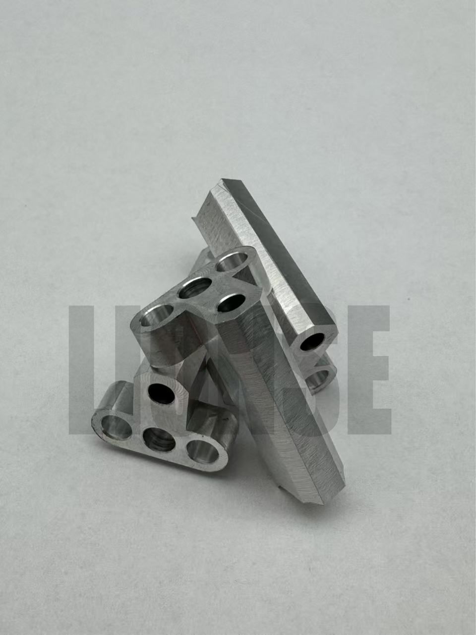 Small Precision Machined Perforated Metal Connecting Bracket